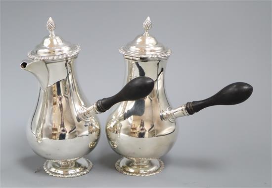 A pair of late Victorian silver cafe au lait pots and matching sugar bowl, by John Newton Mappin, London, 1894,